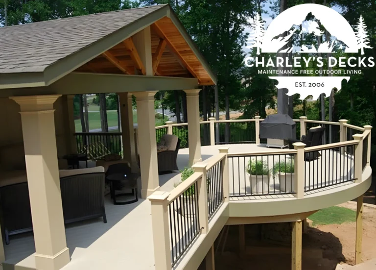 Raised covered deck with a gable roof, white posts, and black balusters