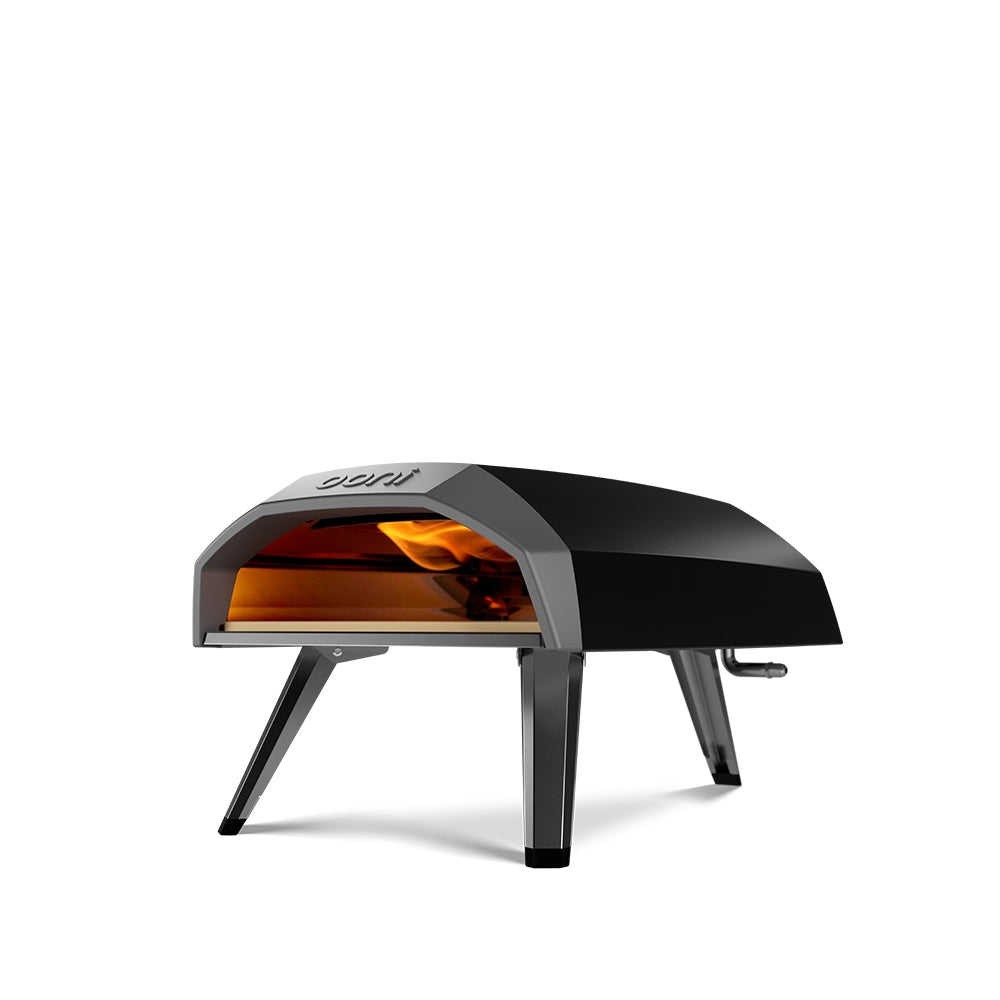 Ooni outdoor pizza oven with a flame visible inside
